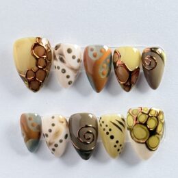 Rustic Mosaic fall press-on nail set with terrazzo pattern and copper crack detailing