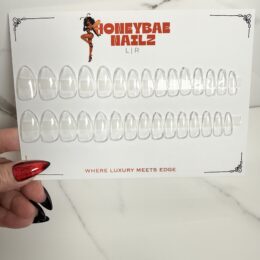 Blank almond press-on nail tips in sizes 00 to 13 on a HoneyBae Nailz display card